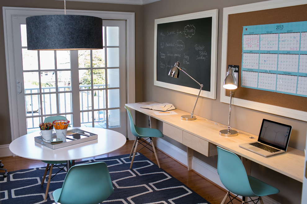 Photo of a contemporary home office in DC Metro with beige walls.