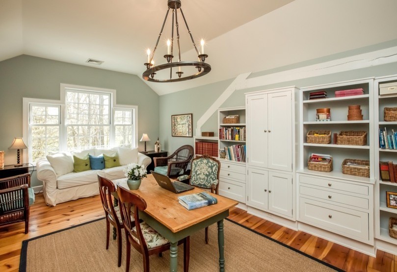 Large elegant freestanding desk dark wood floor and brown floor study room photo in Bridgeport with green walls and no fireplace