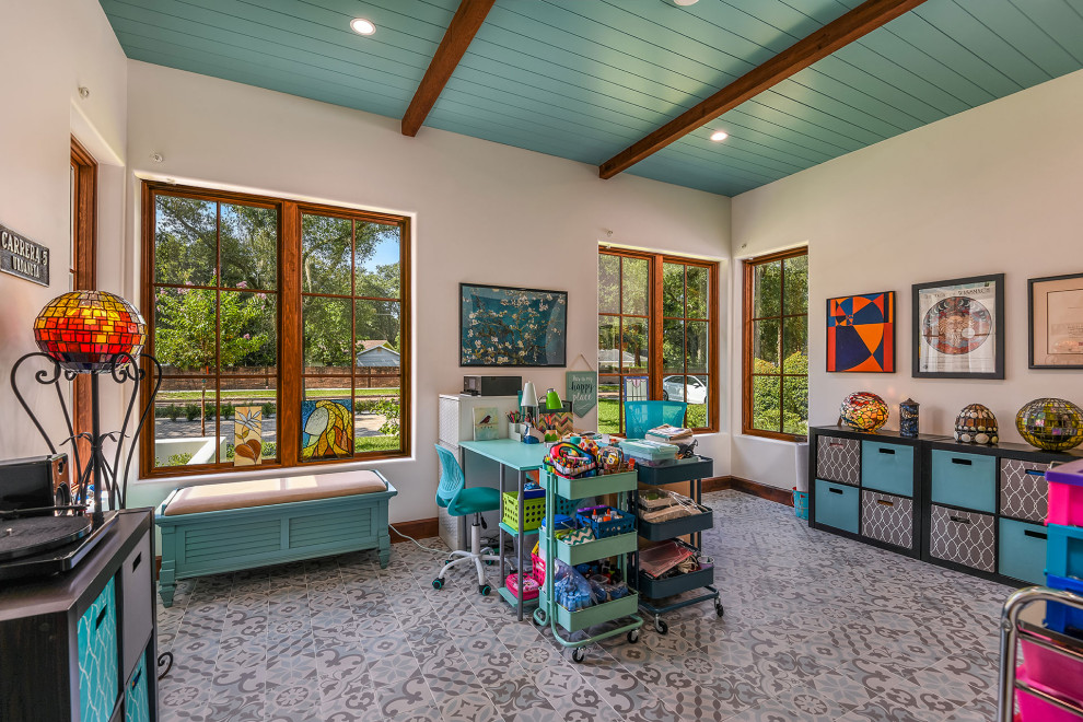 Large mediterranean craft room in Orlando with porcelain flooring, multi-coloured floors and exposed beams.