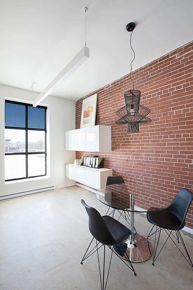 Imagen de despacho moderno de tamaño medio con paredes rojas, suelo de cemento y escritorio independiente