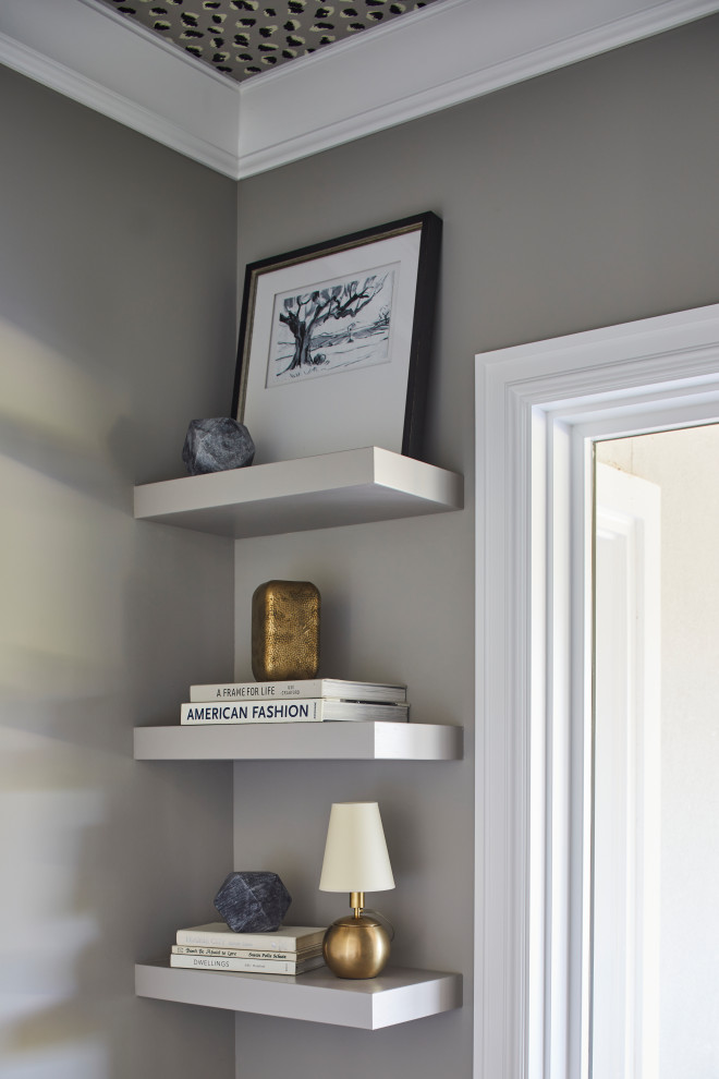 Example of a small transitional built-in desk travertine floor, beige floor and wallpaper ceiling study room design in Other with gray walls