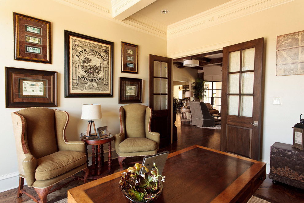 Elegant freestanding desk dark wood floor and brown floor study room photo in Dallas with white walls