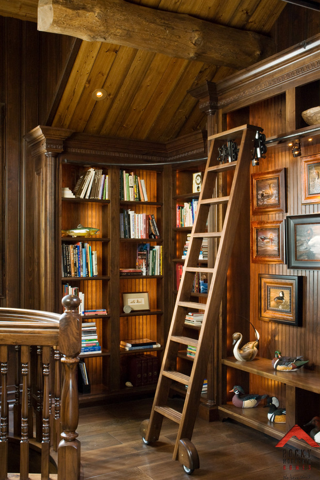 Photo of a medium sized rustic study in Other with medium hardwood flooring and a freestanding desk.