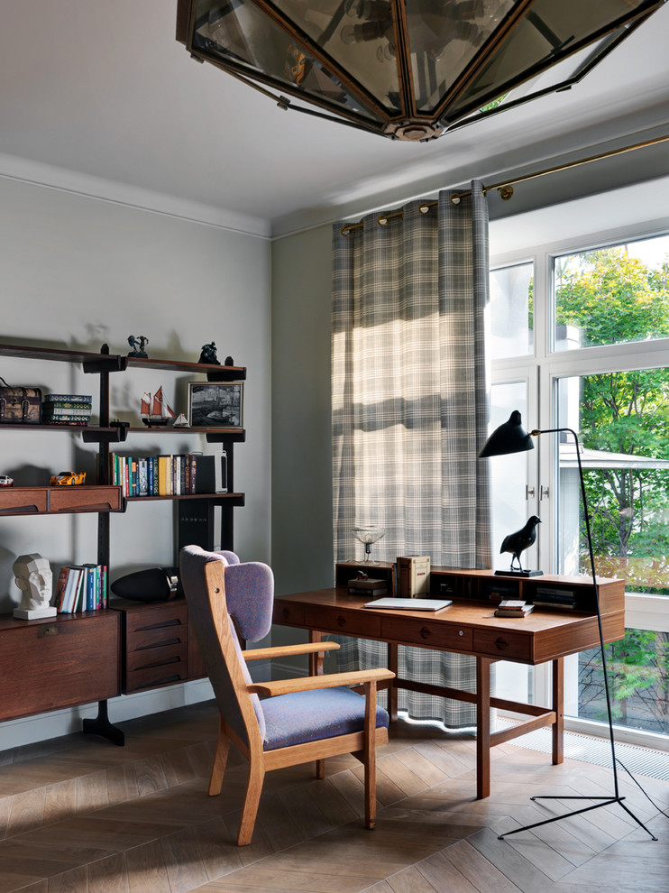 Example of an arts and crafts home office design in Moscow