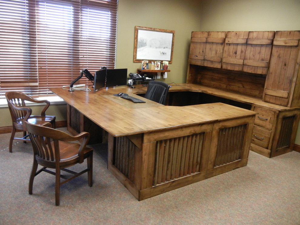 Example of a large mountain style freestanding desk home office design in Omaha