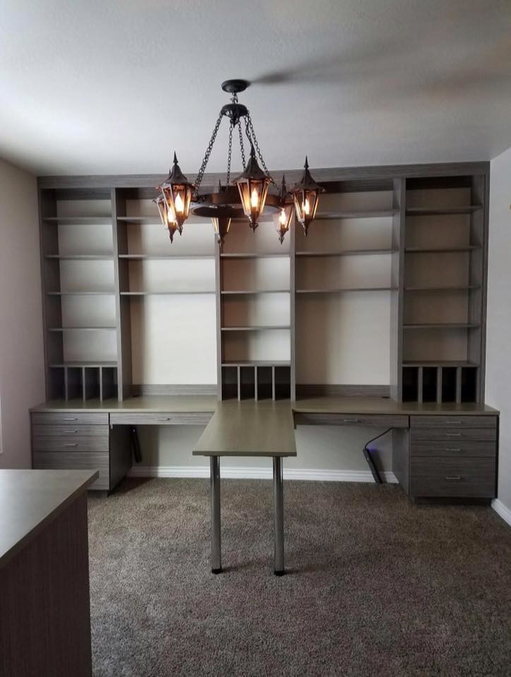 Mid-sized built-in desk carpeted craft room photo in Salt Lake City