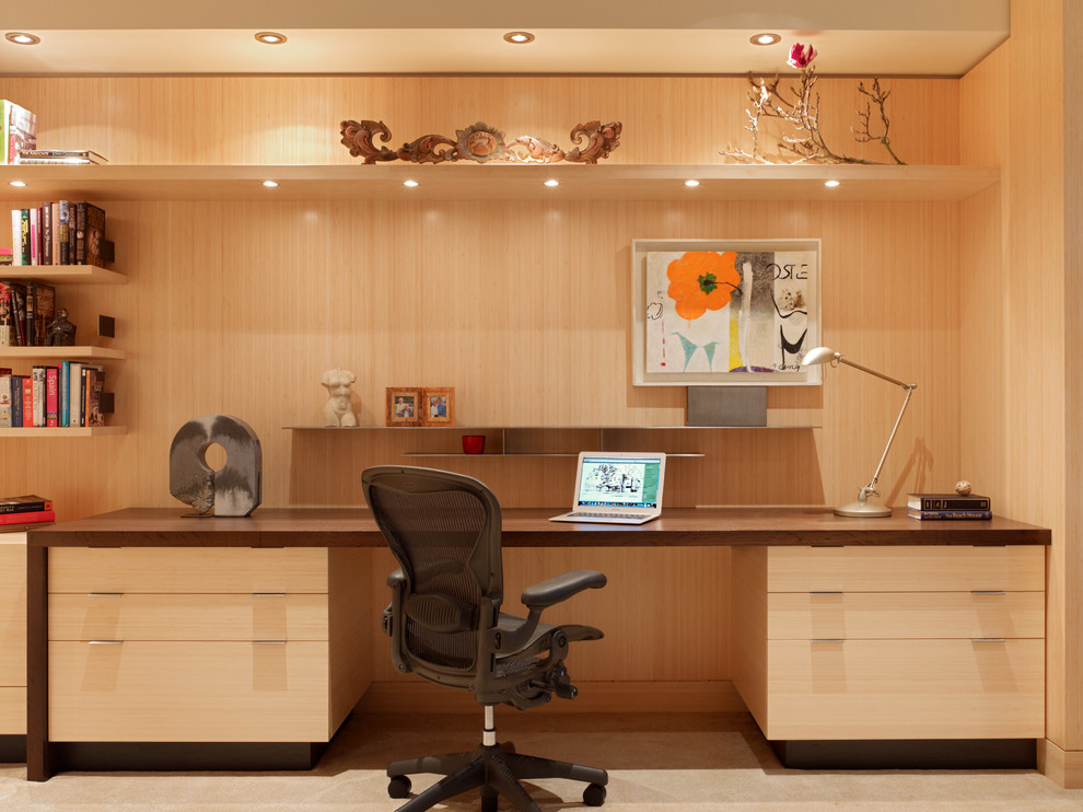 Study room - mid-sized modern built-in desk carpeted study room idea in San Francisco with beige walls and no fireplace