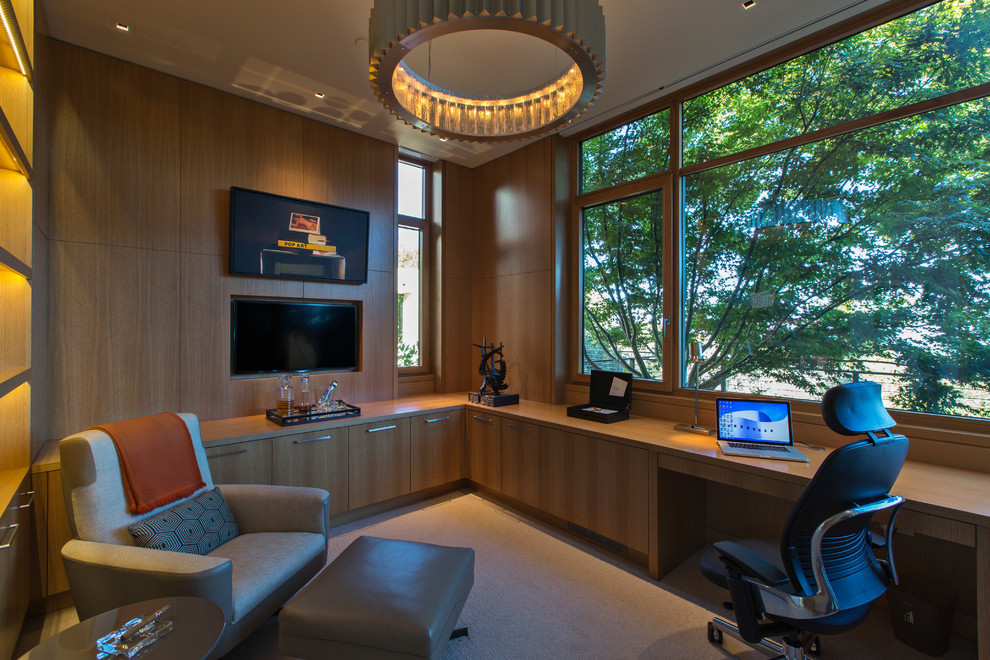 Imagen de despacho contemporáneo de tamaño medio con moqueta y escritorio empotrado