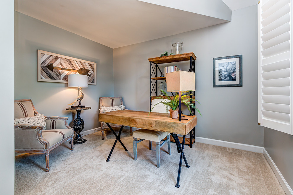 Inspiration for a mid-sized transitional freestanding desk carpeted and gray floor study room remodel in Charlotte with gray walls and no fireplace