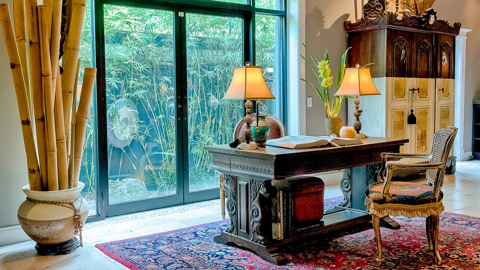 Medium sized bohemian home office in Miami with a reading nook, grey walls and limestone flooring.