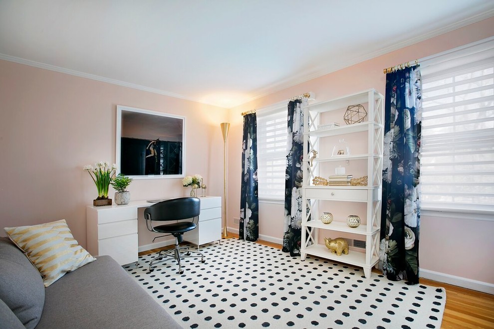 Study room - mid-sized transitional freestanding desk light wood floor study room idea in New York with pink walls