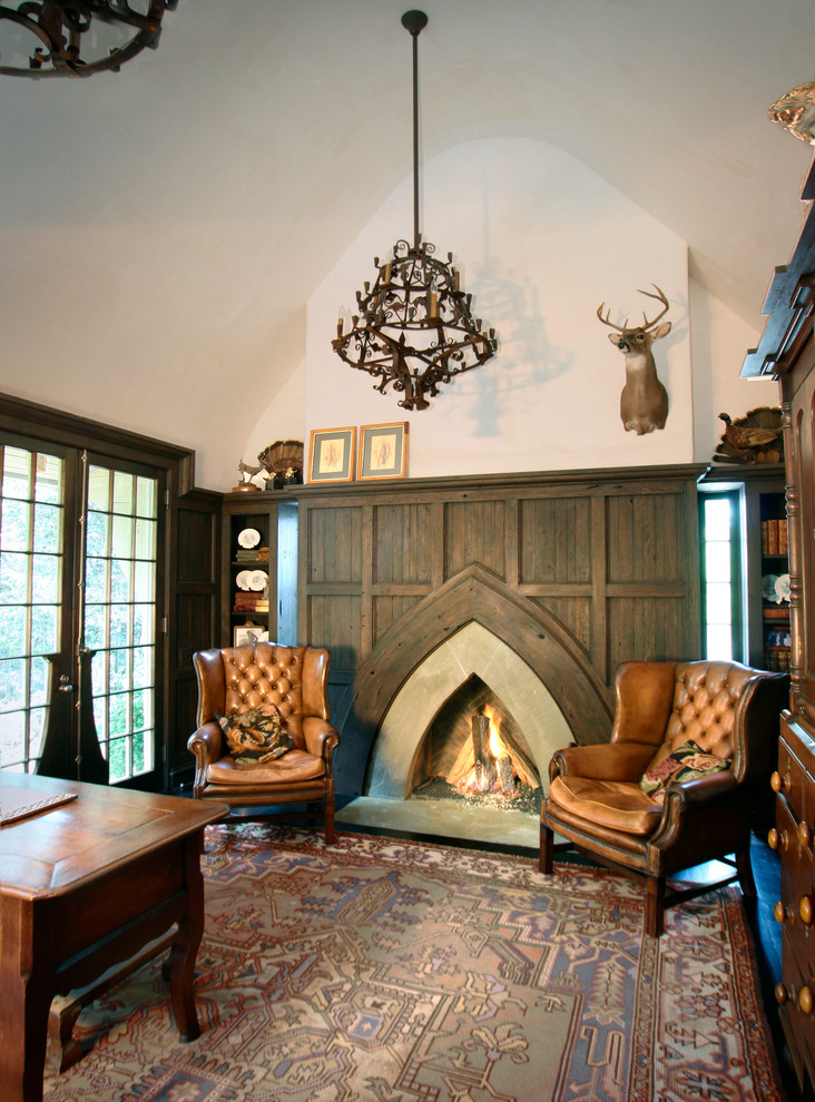 Home office - traditional home office idea in Charlotte with beige walls, a standard fireplace and a concrete fireplace
