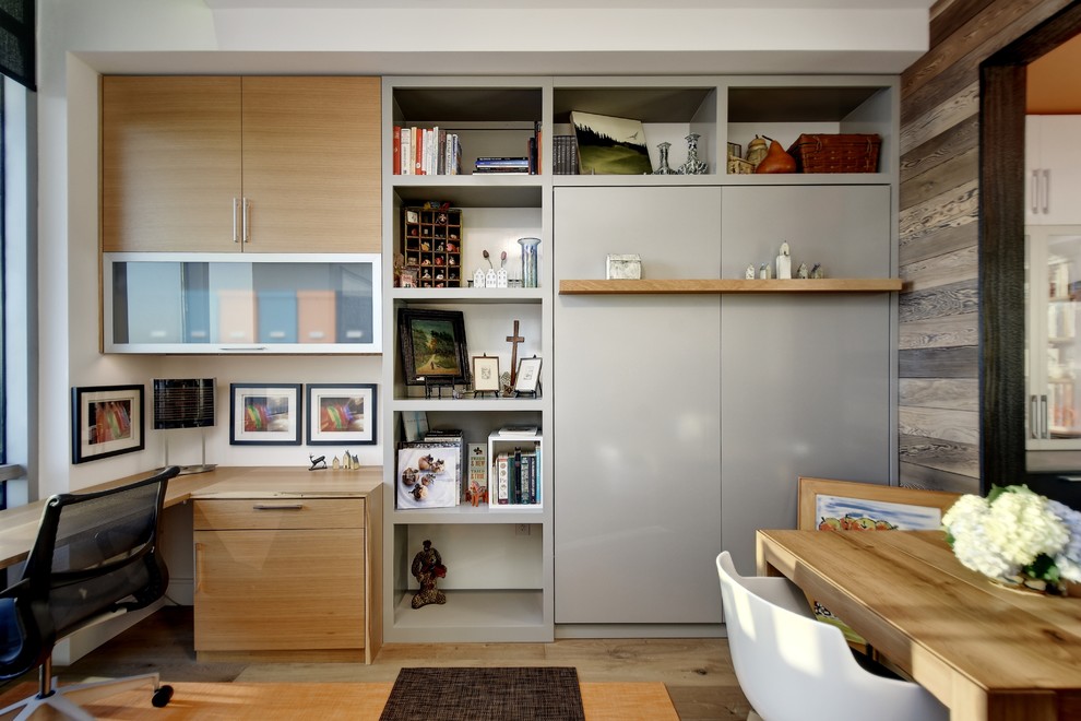Contemporary home office in Austin with a built-in desk.