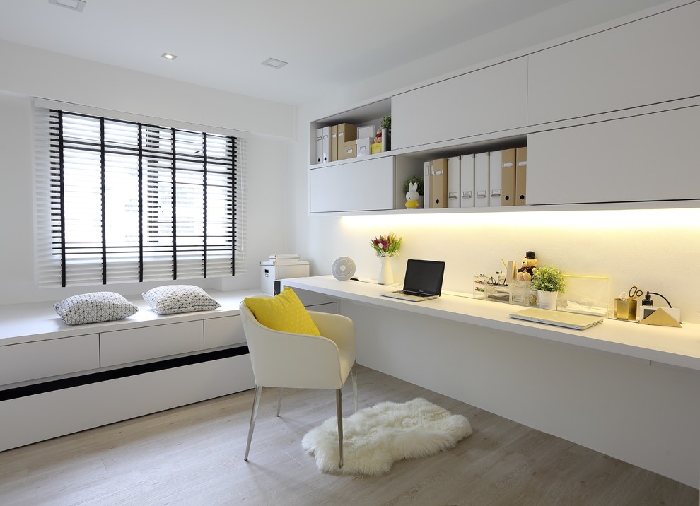 Scandi study in Singapore with white walls, light hardwood flooring and a built-in desk.