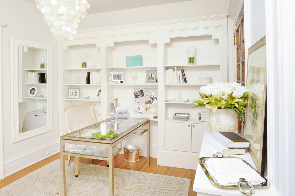 Medium sized traditional home office in Philadelphia with white walls, medium hardwood flooring, a freestanding desk and beige floors.