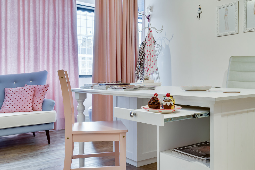 Small home studio in Other with multi-coloured walls, vinyl flooring and a freestanding desk.