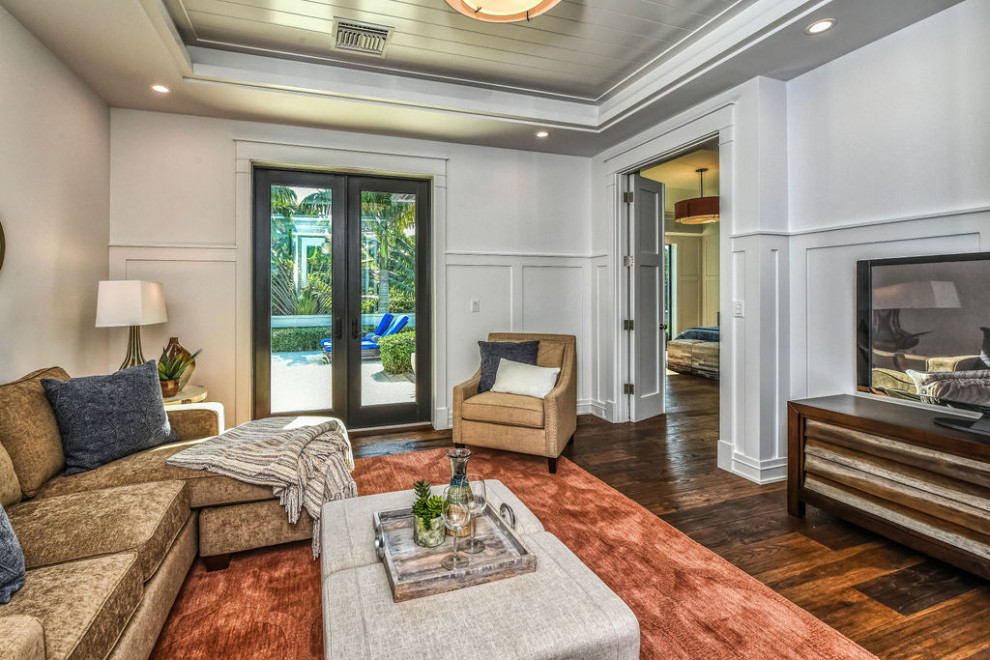 Large contemporary study in Tampa with white walls, a drop ceiling and wainscoting.