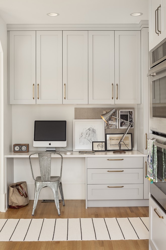 Transitional built-in desk home office photo in Vancouver