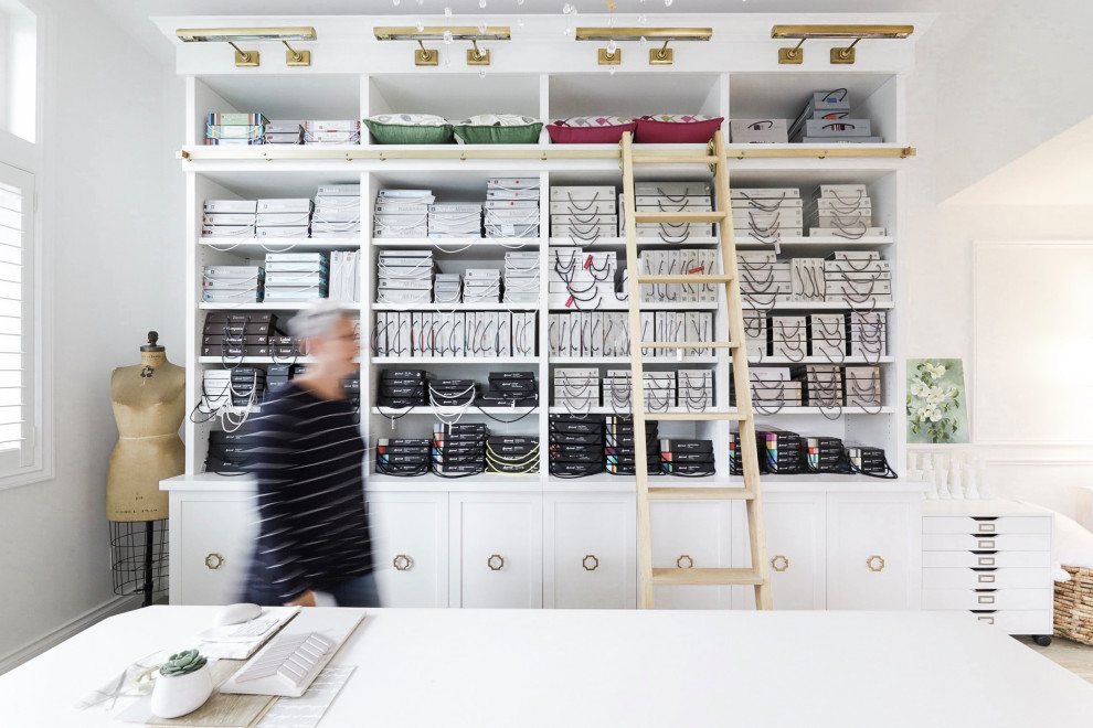 Inspiration for a small traditional home studio in Vancouver with white walls, vinyl flooring, no fireplace, a built-in desk and beige floors.