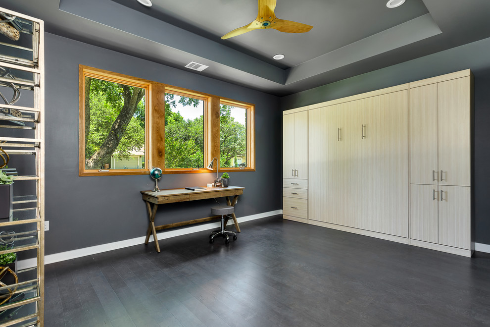 Example of a large trendy freestanding desk bamboo floor study room design in Austin with gray walls and no fireplace