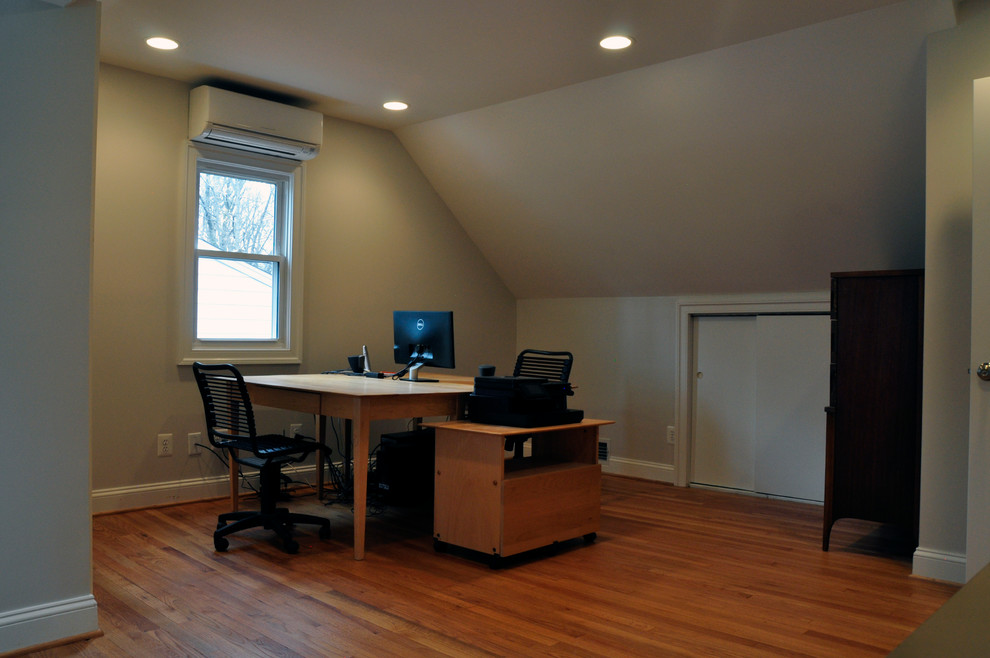 Photo of a medium sized traditional home office in DC Metro with grey walls, light hardwood flooring, no fireplace and a freestanding desk.