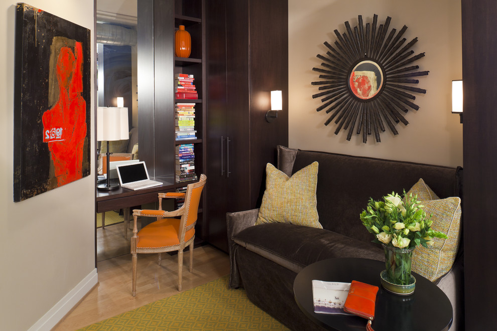 Small trendy built-in desk medium tone wood floor home office photo in DC Metro with beige walls