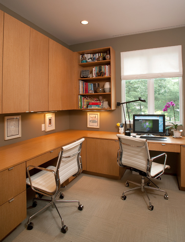 Inspiration for a contemporary built-in desk home office remodel in Milwaukee with gray walls
