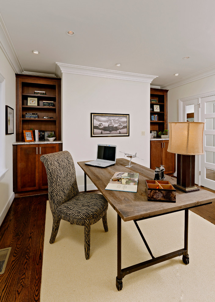 Photo of a medium sized eclectic study in DC Metro with white walls, medium hardwood flooring, a freestanding desk and brown floors.