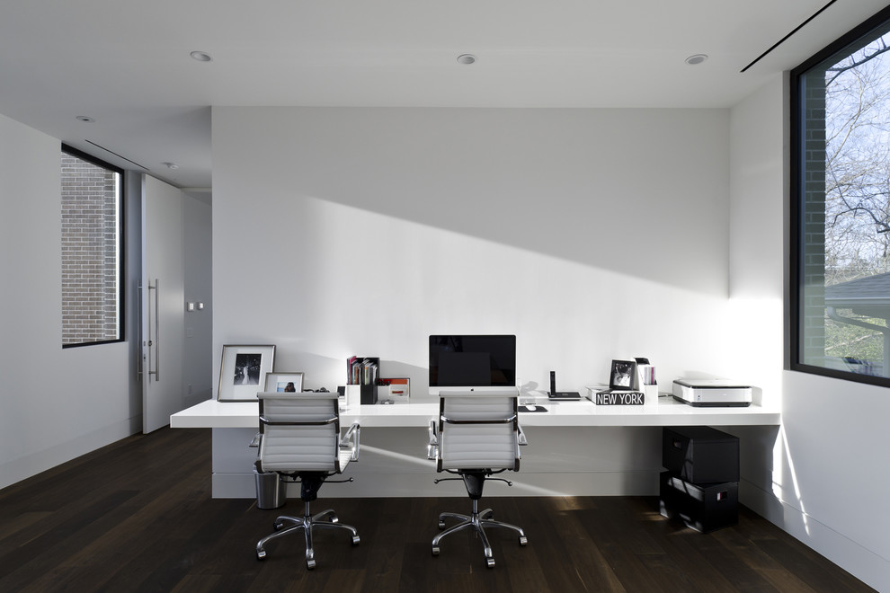Inspiration for a modern home office remodel in Houston with white walls