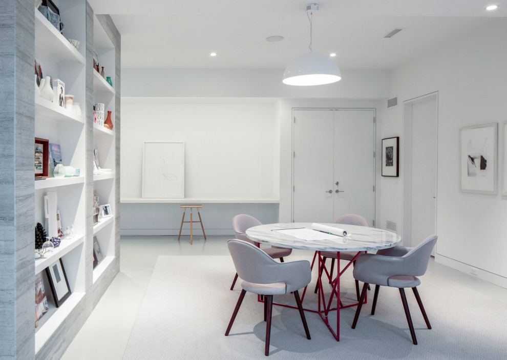 This is an example of a medium sized contemporary home office in New York with ceramic flooring, no fireplace, a freestanding desk and white floors.