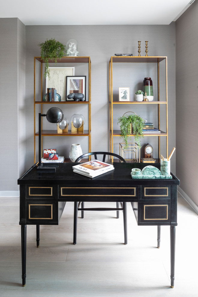 Contemporary study in London with grey walls, a freestanding desk and grey floors.