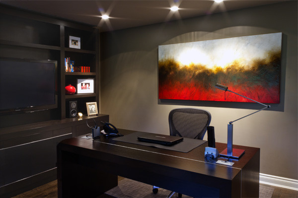 Example of a mid-sized trendy freestanding desk medium tone wood floor study room design in Vancouver with beige walls