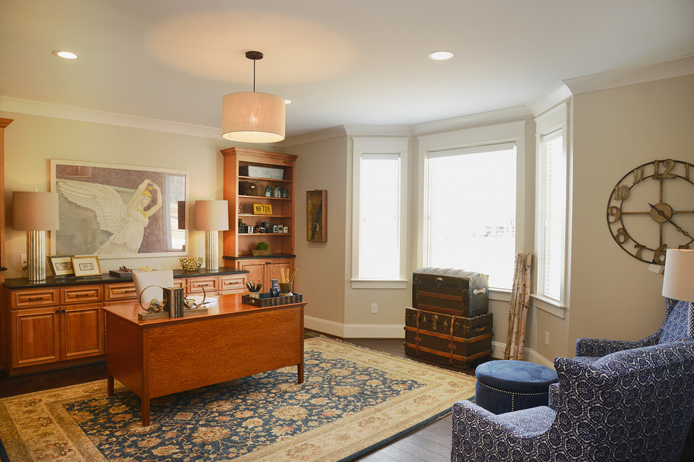 Photo of a traditional home office in Other with beige walls, dark hardwood flooring and a freestanding desk.