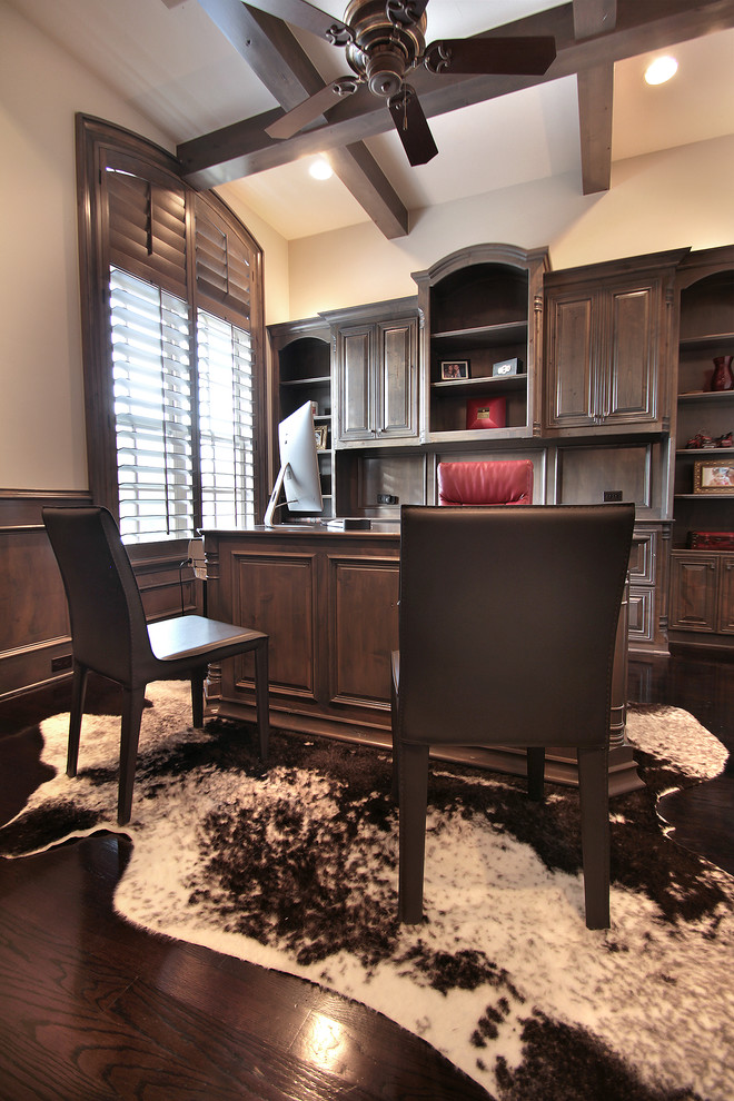 Example of a classic freestanding desk dark wood floor study room design in Dallas