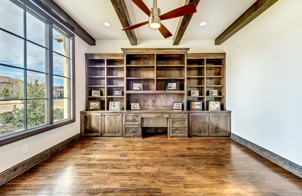 Inspiration for a medium sized traditional study in Dallas with medium hardwood flooring and a built-in desk.