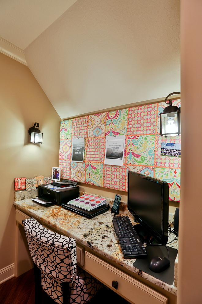 Photo of a medium sized eclectic craft room in Atlanta with beige walls and a built-in desk.