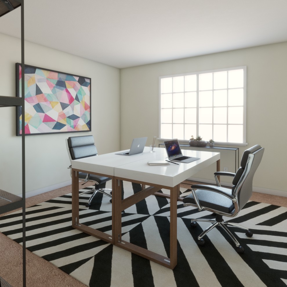 Imagen de despacho actual de tamaño medio sin chimenea con paredes beige, moqueta, escritorio independiente y suelo marrón