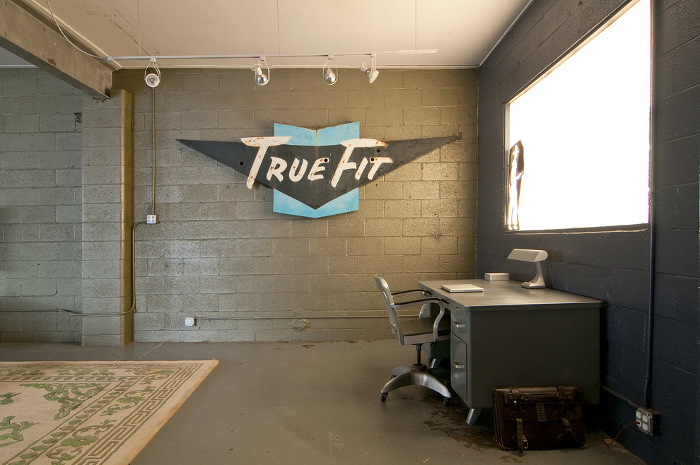 Example of an urban freestanding desk home office design in Salt Lake City with gray walls