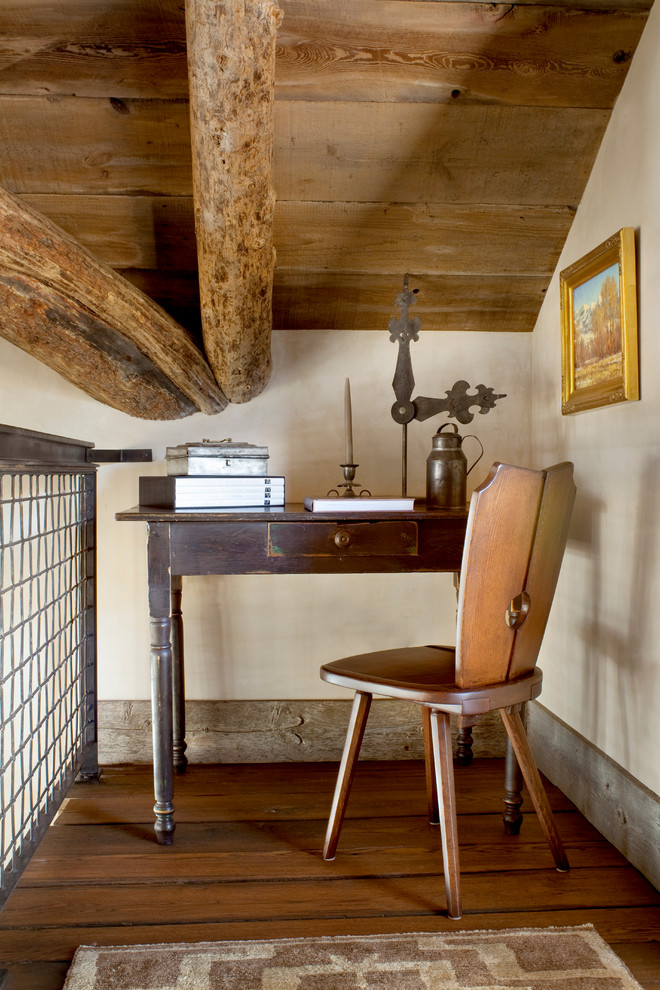 Inspiration for a rustic freestanding desk dark wood floor home office remodel in Other with white walls