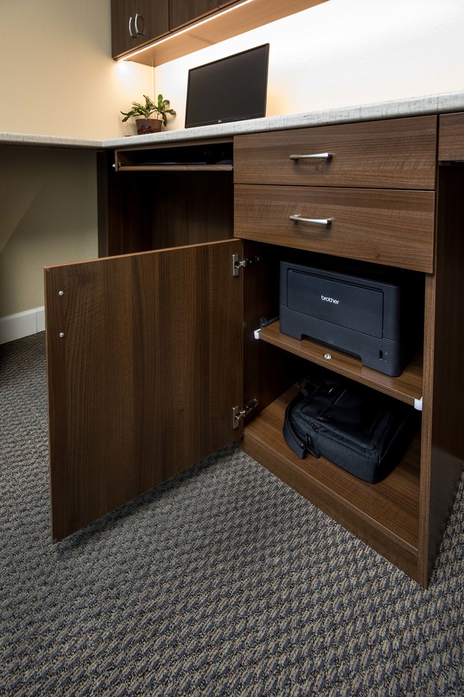 Example of a mid-sized trendy built-in desk carpeted study room design in San Francisco with beige walls and no fireplace