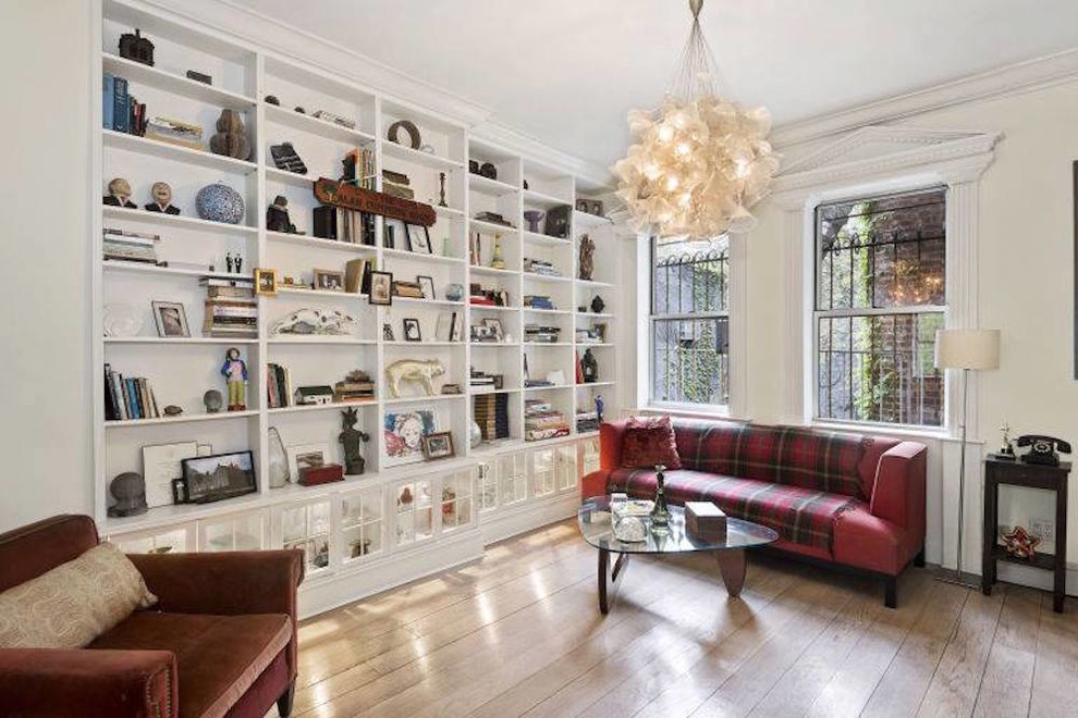 Inspiration for a mid-sized timeless light wood floor and beige floor study room remodel in New York with white walls