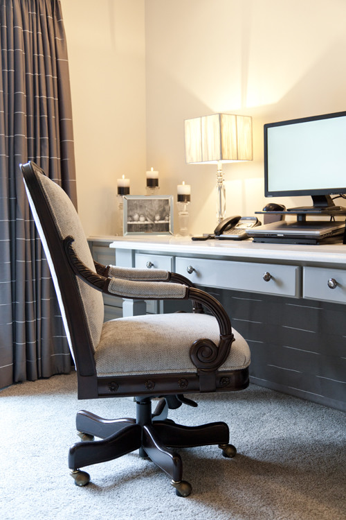 Inspiration for a medium sized traditional home office in Charlotte with beige walls, carpet and a built-in desk.
