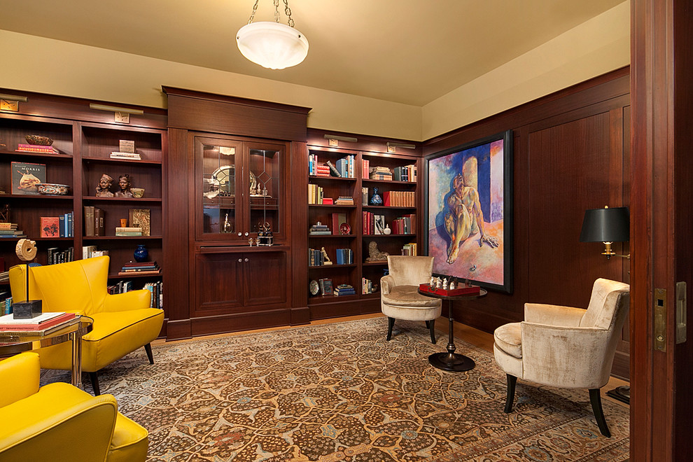 Example of a large classic freestanding desk light wood floor study room design in Seattle with beige walls and no fireplace