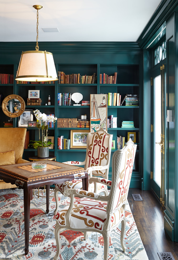 Elegant freestanding desk dark wood floor study room photo in New York with green walls