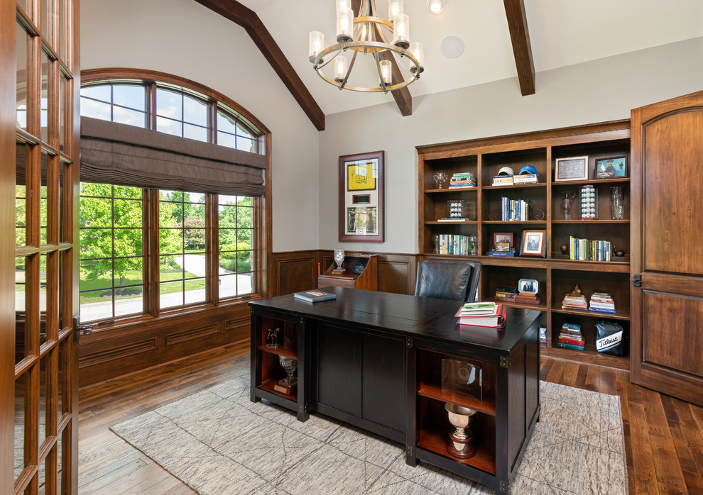 Inspiration for a mid-sized timeless freestanding desk medium tone wood floor study room remodel in Cincinnati with gray walls and no fireplace