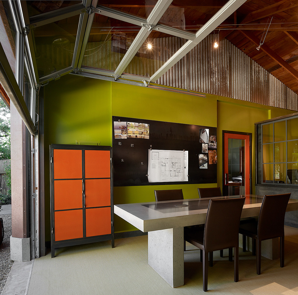 Example of a large trendy freestanding desk carpeted home studio design in San Francisco with green walls and no fireplace