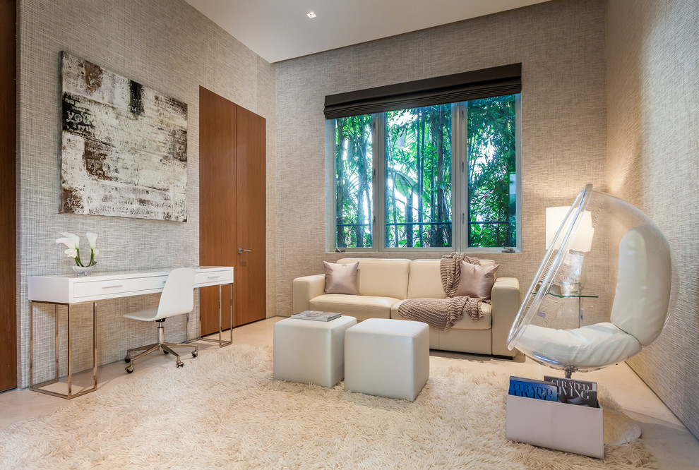 This is an example of a contemporary home office in Miami with grey walls, no fireplace and a freestanding desk.