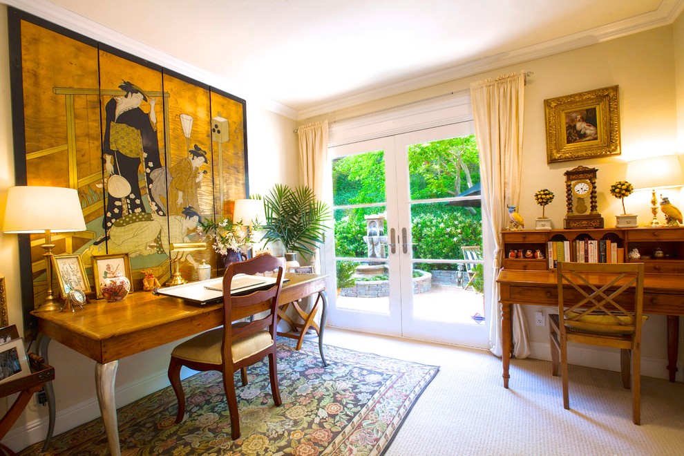 This is an example of a medium sized traditional study in San Francisco with beige walls, carpet and a freestanding desk.