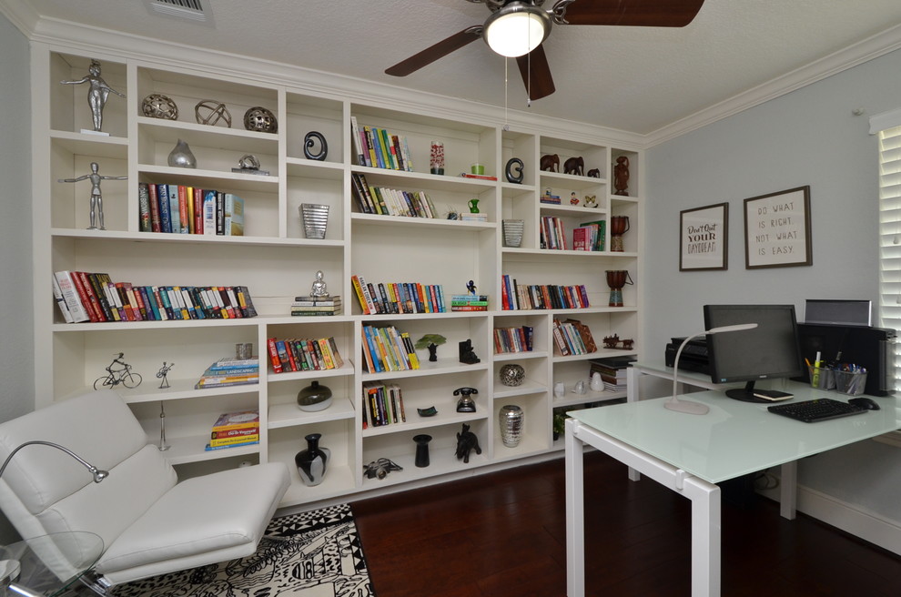 Inspiration for a medium sized modern study in Houston with grey walls, medium hardwood flooring and a freestanding desk.