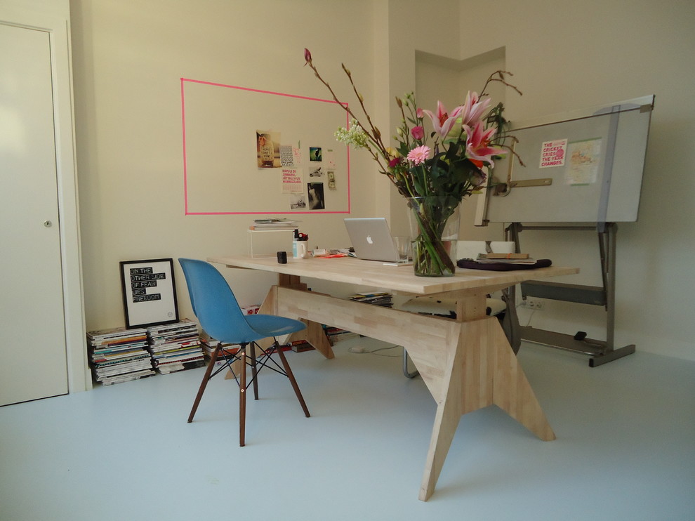 Trendy freestanding desk white floor home office photo in Amsterdam with beige walls